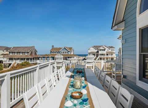 Seaside serenity awaits at this sunlit table, with endless ocean views!