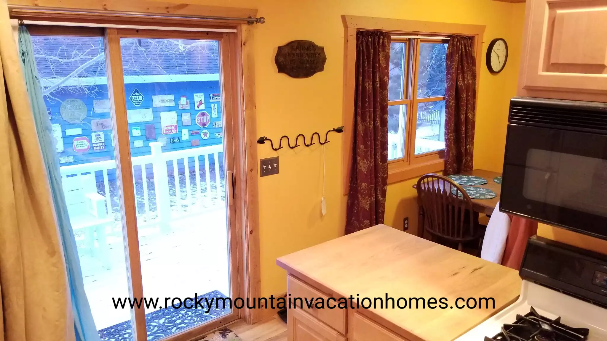 Access to the backyard from the kitchen. A boot tray is by this door as well.