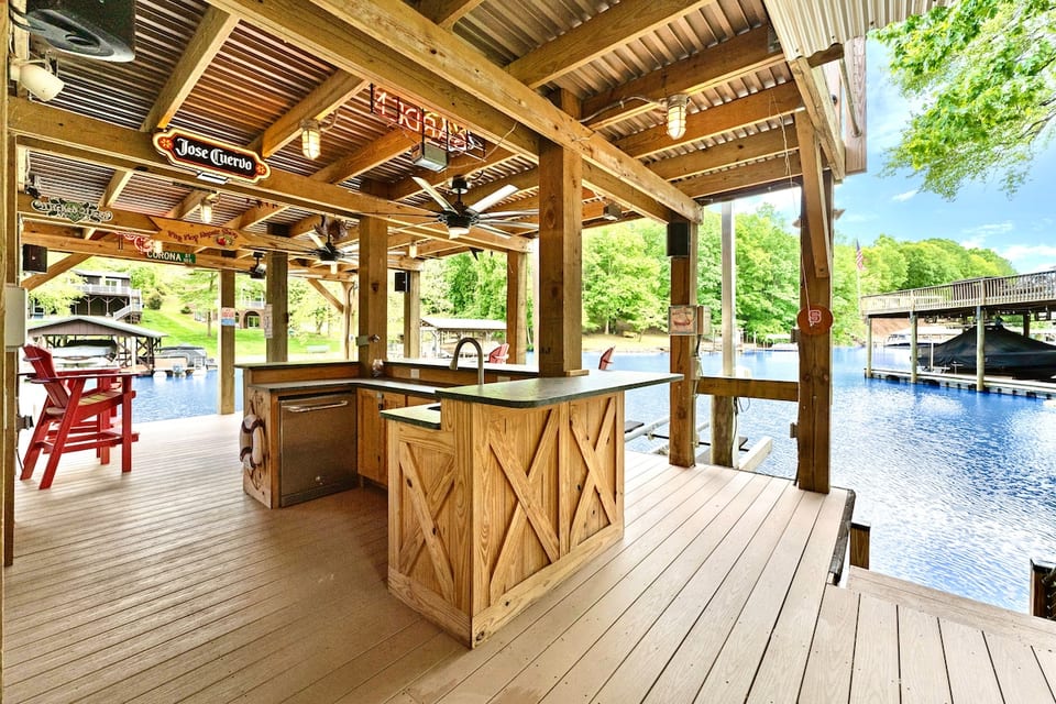 Oversized two story dock with deep water and guest slip available. Fridge and sink on dock. Ask us about boat rental options!