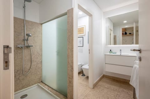 Bathroom Retreat: Modern elegance meets functionality with sleek lines and warm tones!