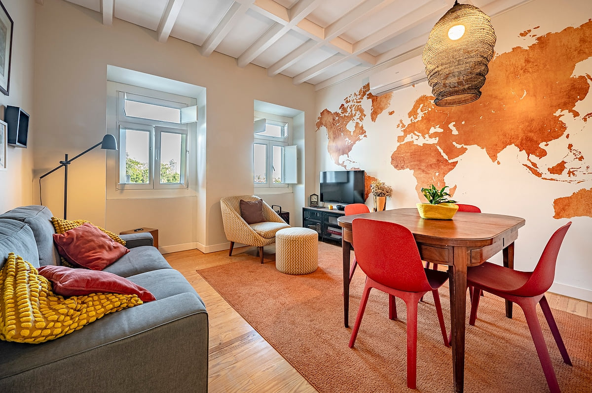 Living Room: Bright and vibrant space featuring a world map mural, perfect for relaxation and fun!