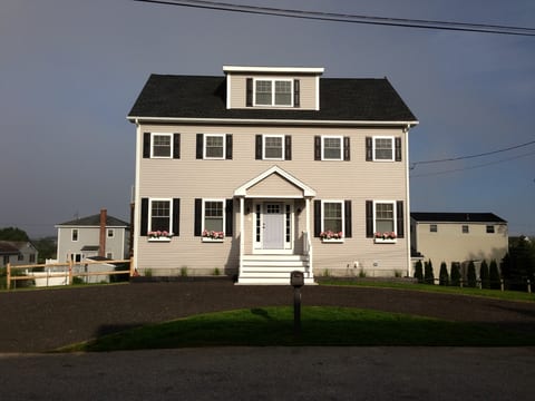 The front of the house with expansive private parking onsite.