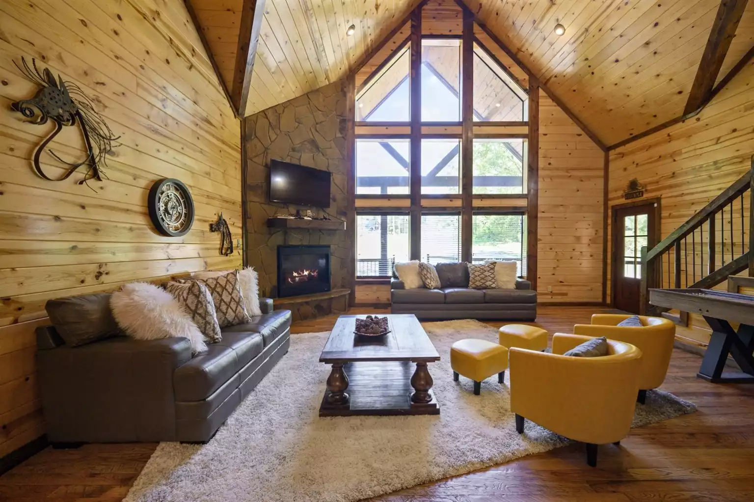 Open living space with a gas fireplace to stay warm Open living space with a gas fireplace to stay warm - Iron Horse Lodge - Broken Bow