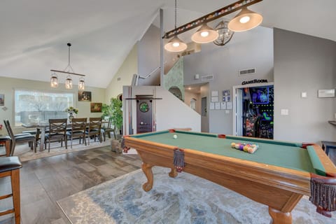 Pool table room with dining room and game room beyond. Super fun house!