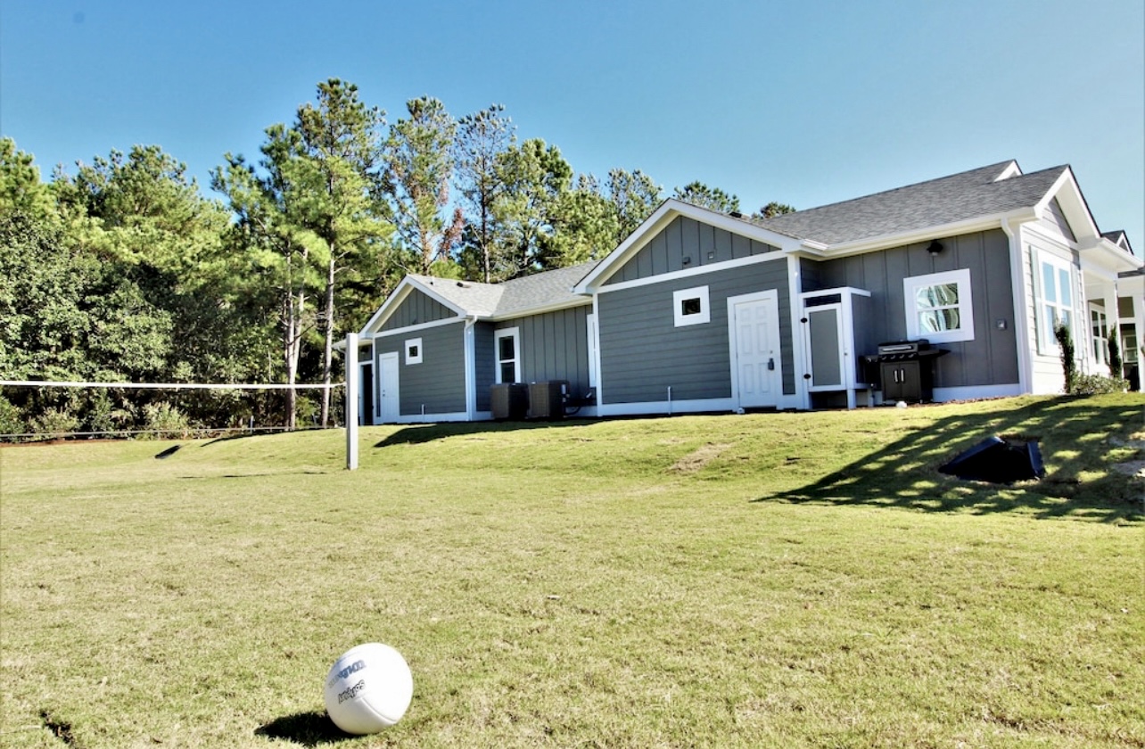 Large field for volleyball, soccer, football, running, jumping, play, end unit with view of field from Kitchen Sink window and Master 1 window