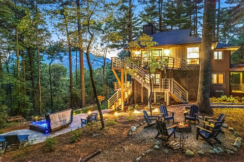 Lots of decks for lounging, hot tub, game lawn, and fire pit.