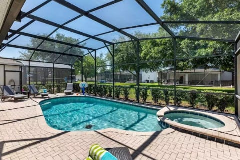 Private screened in, heated salt water pool and spa with oversized pool deck