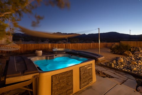 Soak in the hot tub under the stars