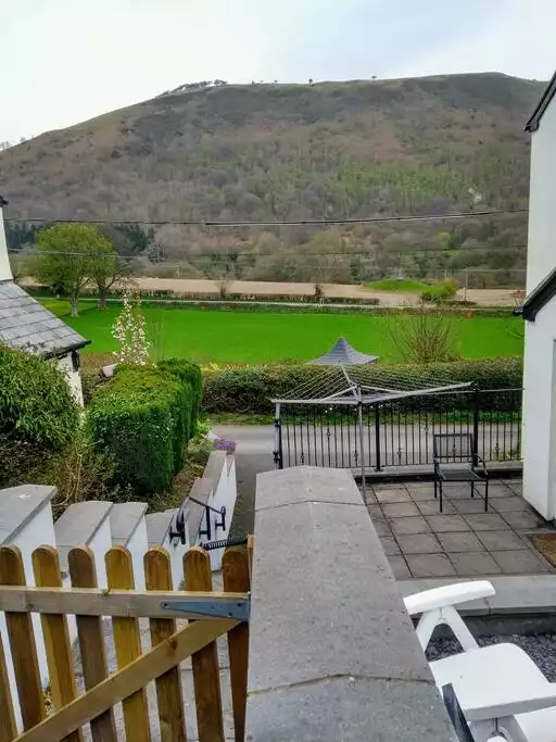 Sheep gate and steps looking towards Eliseg's pillar and Fron Fawr. - Detached holiday cottage with fabulous views - Llantysilio