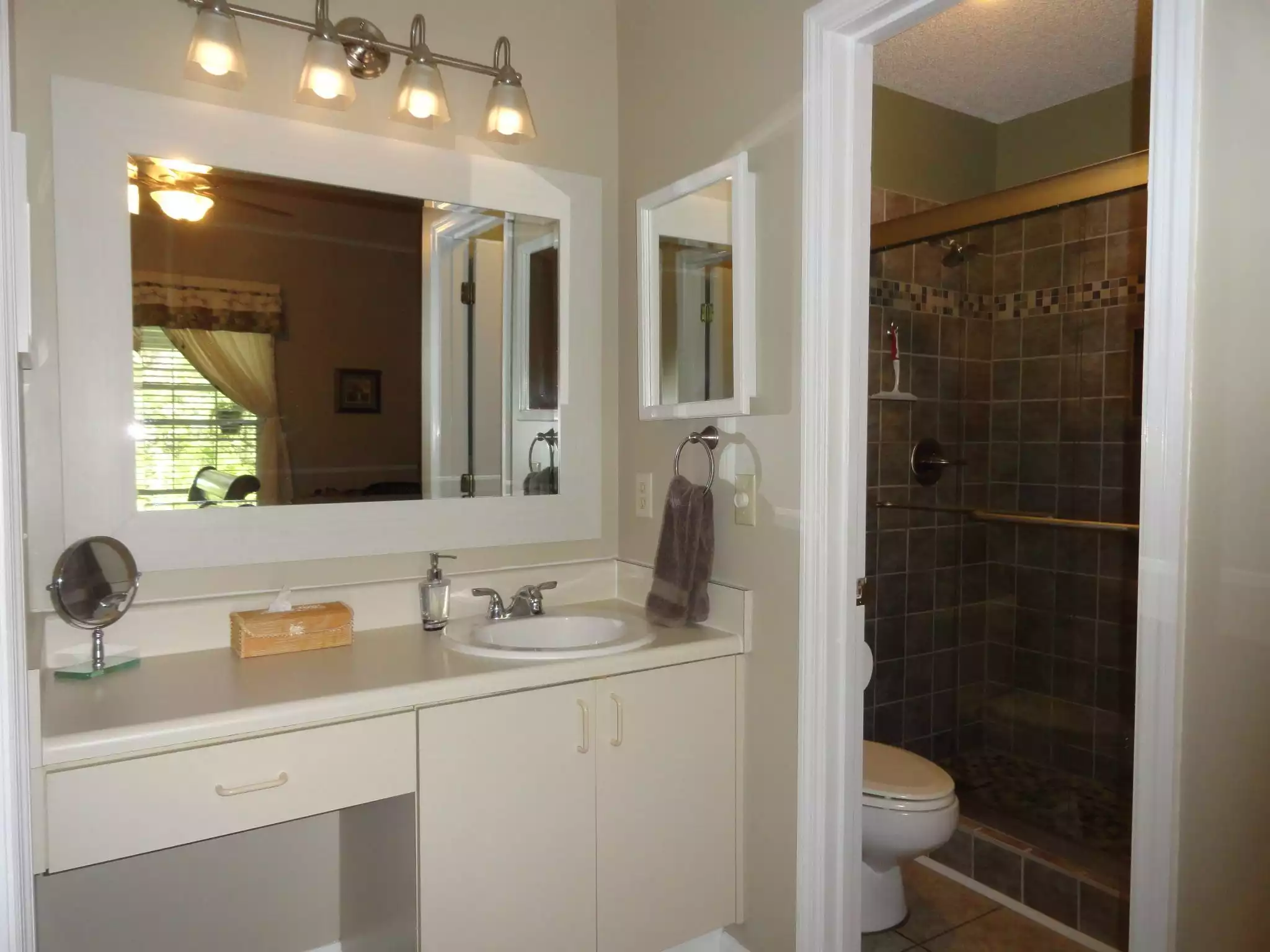 Master bath area with toilet/shower room Master bath area with toilet/shower room - Arli cottage - St Simons Island