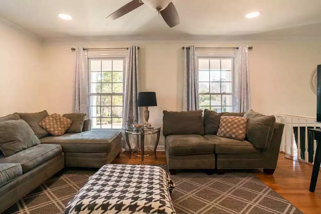 Open living room for entertainment - Cheerful Family-Friendly Home: Ample Outdoor Space - Raleigh