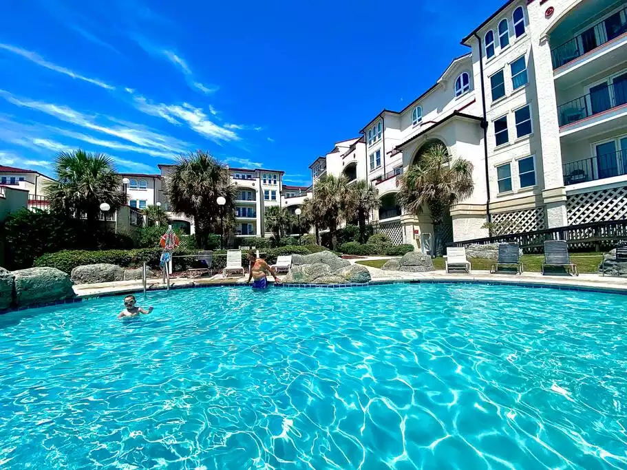 One of the many pools. This one has a waterfall! - Bikini Bottom - Ocean Front; 2 Master Suites - North Topsail Beach