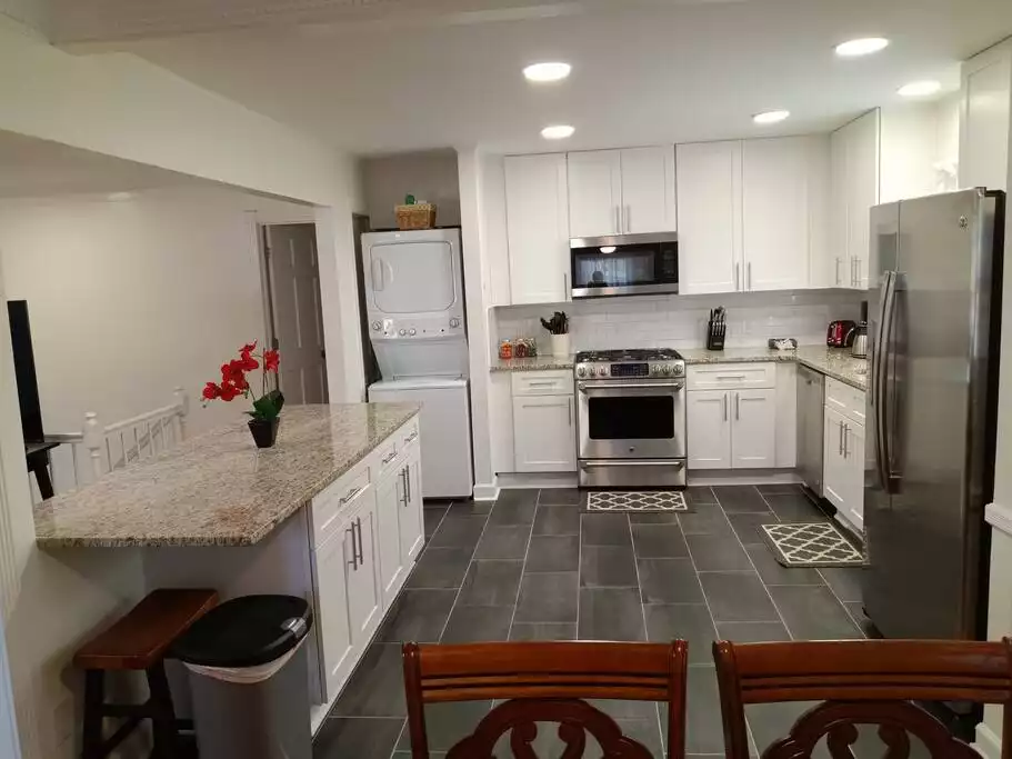 Our kitchen has plenty of space for everyone to prepare meals and visit. - Cheerful Family-Friendly Home: Ample Outdoor Space - Raleigh