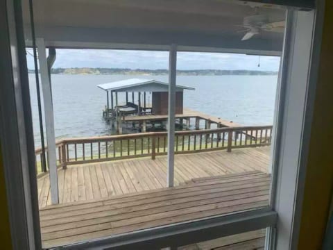 Looking out the back door to boat house and pier
