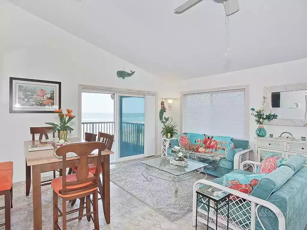 Living room with doors to balcony. Large flat screen TV. Free Wifi Living room with doors to balcony. Large flat screen TV. Free Wifi - SunDance LUXURY ocean home - St. Augustine