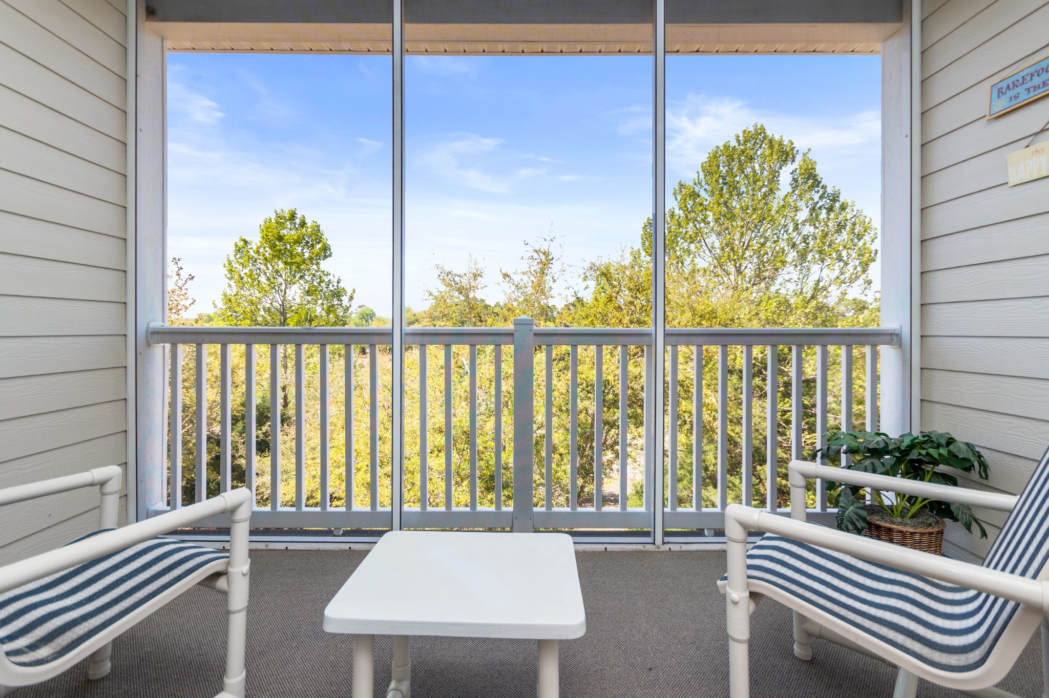 screened balcony looking over the Norman Golf course