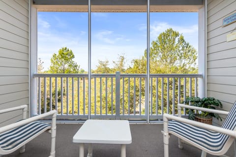 screened balcony looking over the Norman Golf course