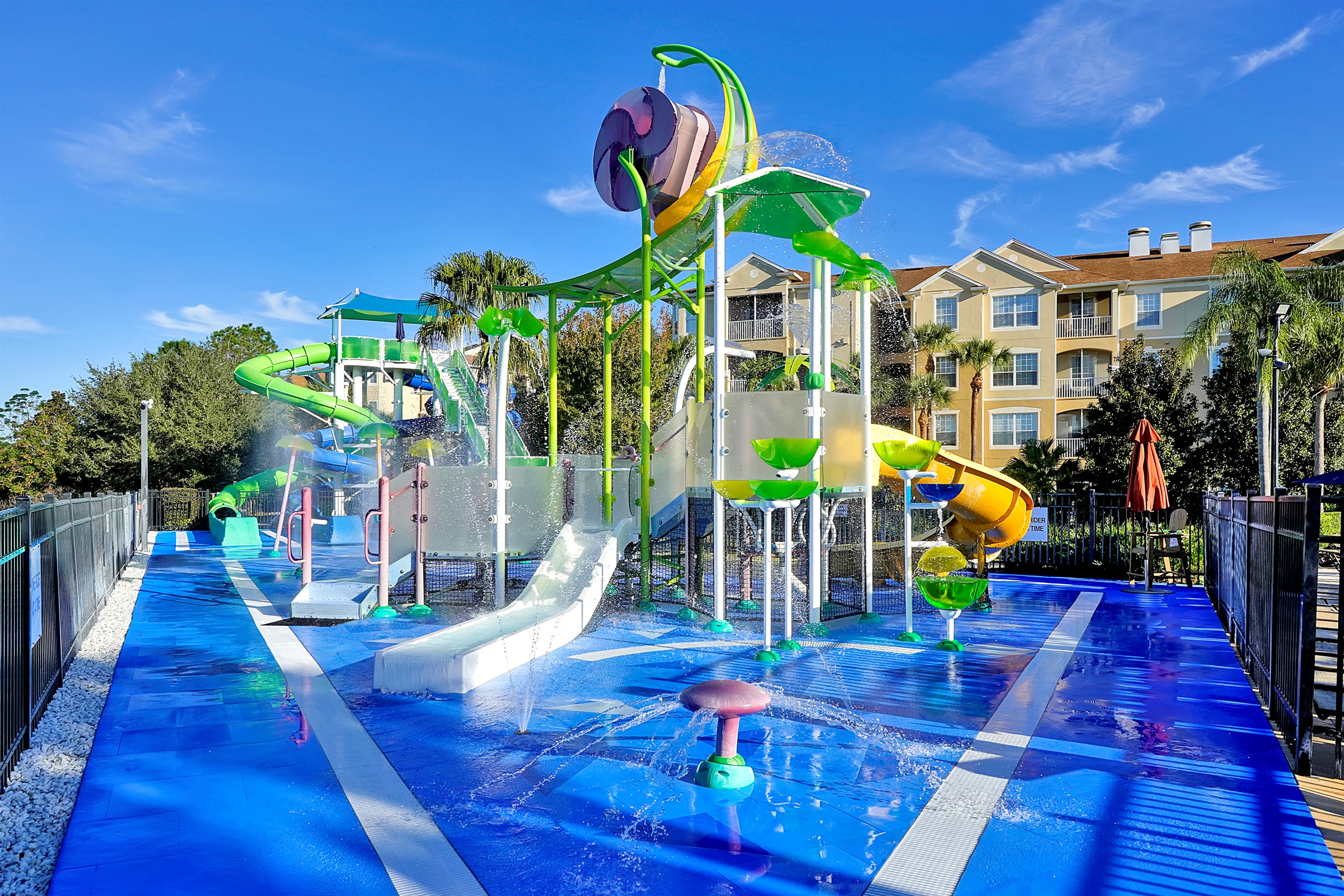 Expansive splash pad and play area with slides, and fountains