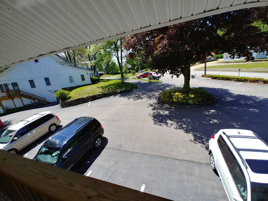 There is plenty of paved parking. This is from the front door. The white building on the left is the office. Additional parking and smoking area in front of office. - Waterfront: King bed Studio ~ Porch ~ Kitchen - Tilton