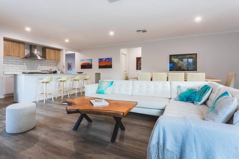 Comfy leather lounge to enjoy TV shows, movies and sport on a 65 inch smart tv with apps and chromecast. Grab a book and relax. Photos by acclaimed photographers Huber and Craig Watson.
