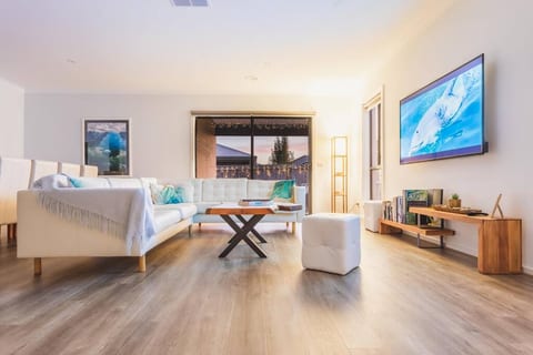 Comfy leather lounge to enjoy TV shows, movies and sport on a 65 inch smart tv with apps and chromecast. Grab a book and relax. Photos by acclaimed photographers Huber and Craig Watson.