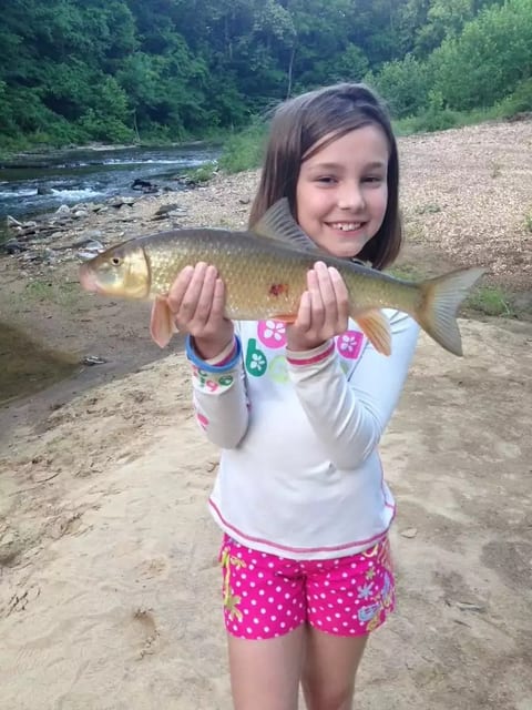 One of our cute guests with her catch on the Wolf River
