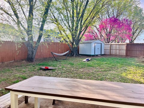 Plenty of seating to sit around and eat a meal after grilling out together! The backyard has a fire pit as well.
