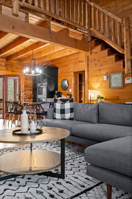 Hang out in the living room by the fireplace. Lounging in the comfortable L-shaped sectional coach. 