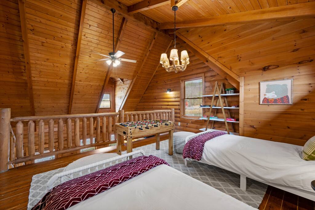 Spacious loft area with two twin sizes beds, a perfect place to hang out, and some board games. Foosball can be a fun family activity.   Perfect place to cut the cords and enjoy family time together without the electronics.
