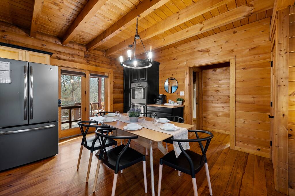 Through the backdoor, you can get to the hot tub and outdoor dining area.  Also, you can see the creek from the back deck.