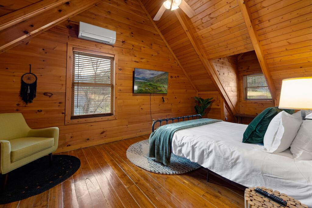 Upstairs bedroom with sitting chair