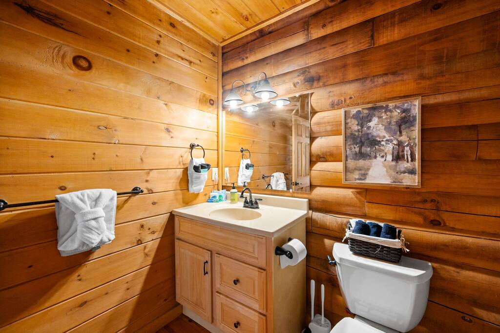 Spacious bathroom on the ground floor. Minimalist decor yet cozy feeling. 