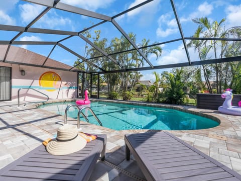 The home has a large heated pool, with new paver deck and new pool cage!