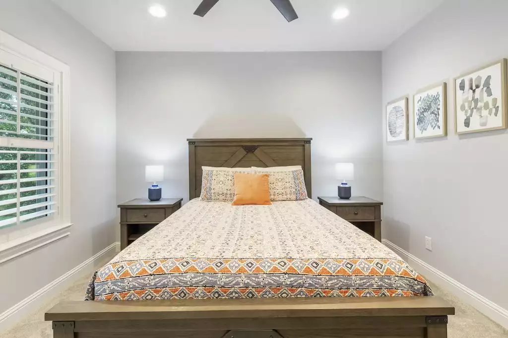 Bedroom #4 has a view of the pool and backyard.  Also has usb ports on headboard - Main House at Whispering Oaks Estate - Dripping Springs