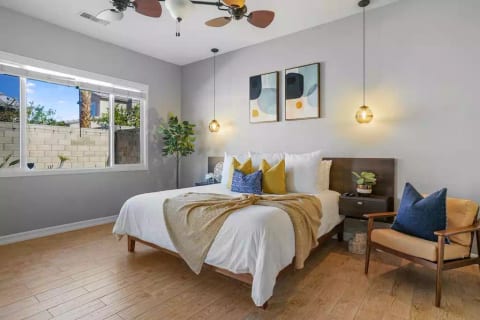 Enormous primary bedroom with private entry to the back yard pool area. Luxuriously comfortable (medium) King -size bed.