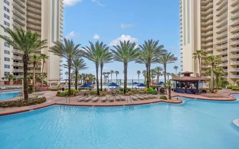 18,000 sq. ft. pool complex with tiki bars serving cold beverages and hot food