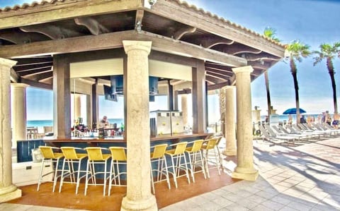 Pool side tiki bar serving drinks