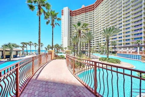 Bridge to pool zero entry area and one of the two tiki bars