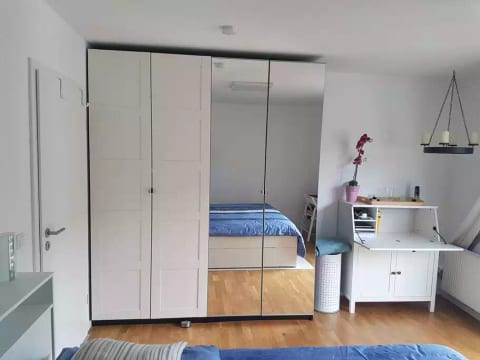 Large wardrobe and laptop-friendly table at your convenience