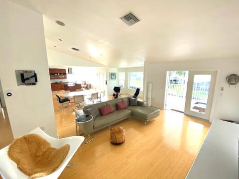 Upstairs living and dining area ; access through double doors to patio and pool downstairs