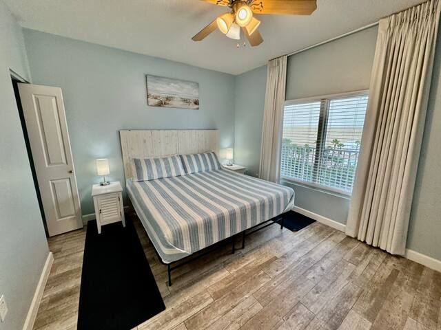 King bedroom has private full bath and custom blackout drapes with blind