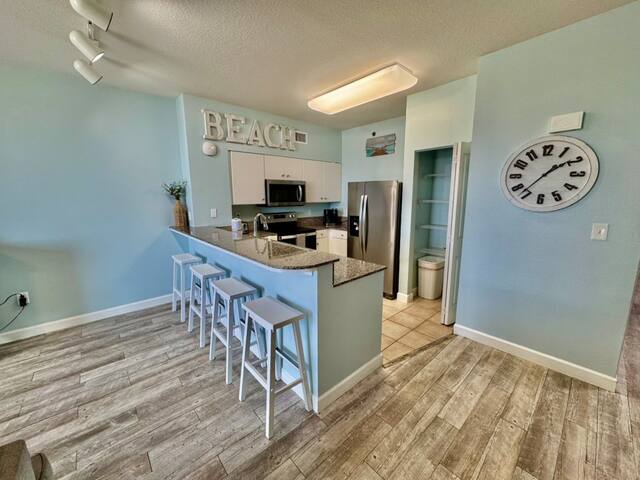 Stainless appliances, granite countertops, and pantry for ample storage