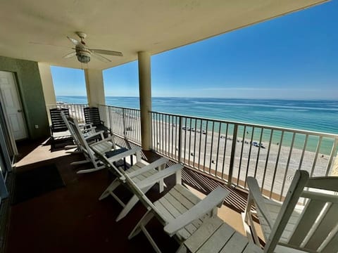 Sliding glass door behind rocking chairs and private access from king bedroom behind loungers