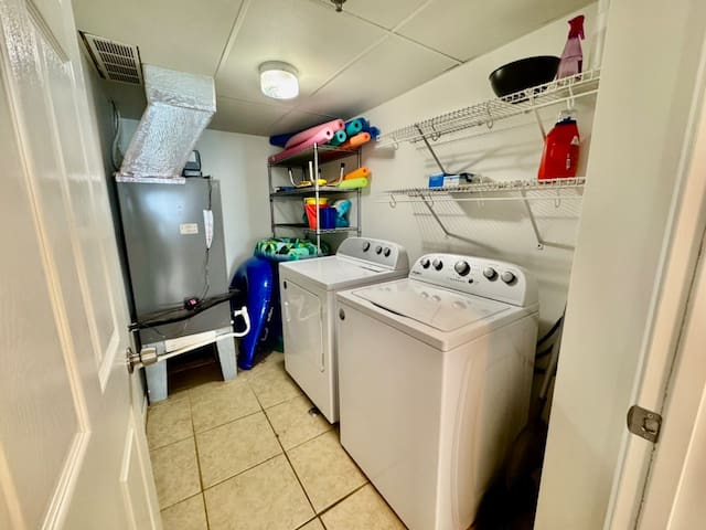 Laundry room with full size washer & dryer. Located to the right just after entering condo