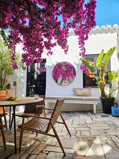Enjoy morning espresso or dinner under the stars and catch shade under the bougainvillea