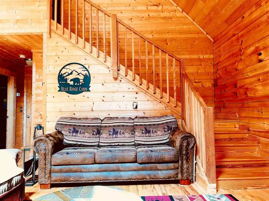 Get the authentic mountain cabin feel here! This sofa pulls out to a queen bed. Get the authentic mountain cabin feel here! This sofa pulls out to a queen bed. - The Blue Ridge Cabin - Roseland