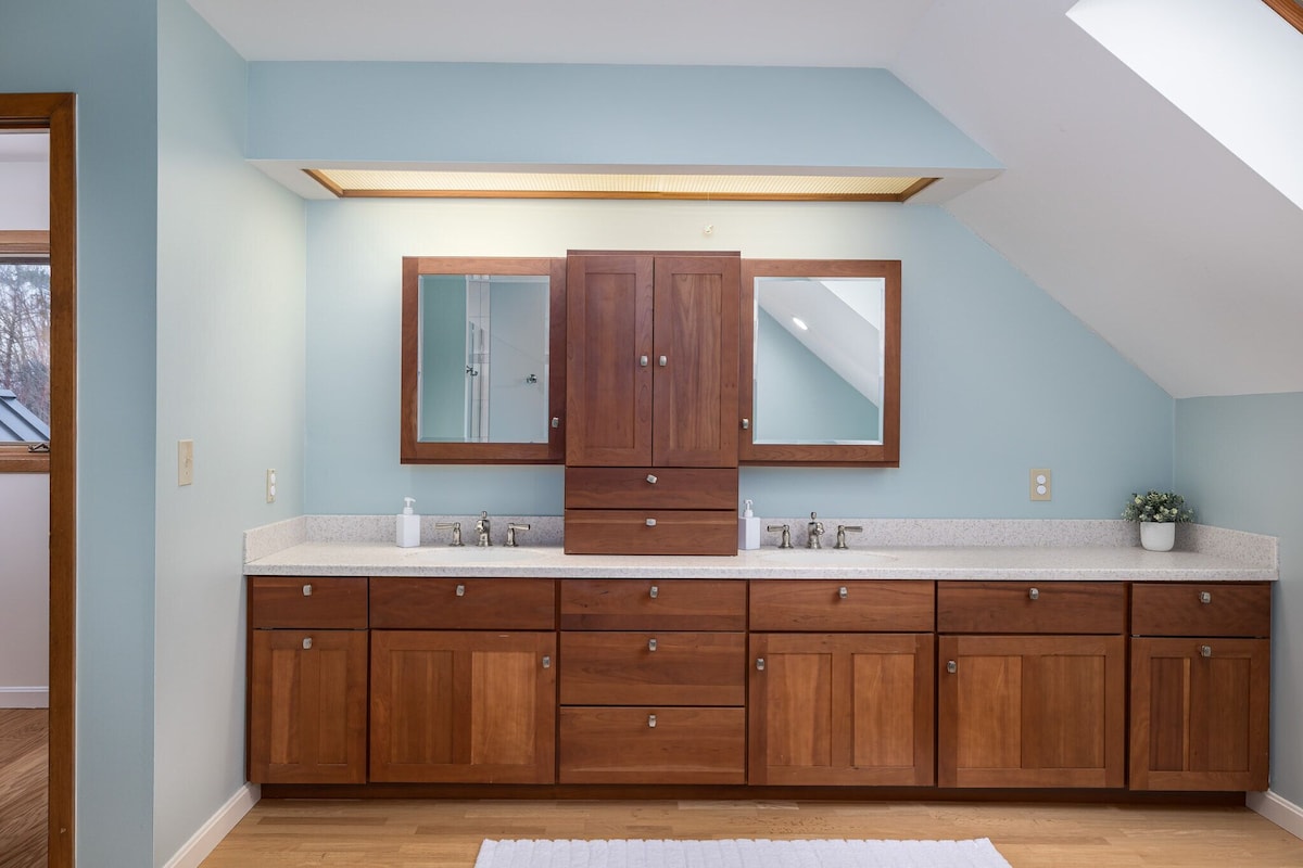 The master ensuite bathroom features double vanities and tons of storage. The master ensuite bathroom features double vanities and tons of storage. - Modern Retreat ~ Stunning Mountain View ~ Hot Tub! - Stowe