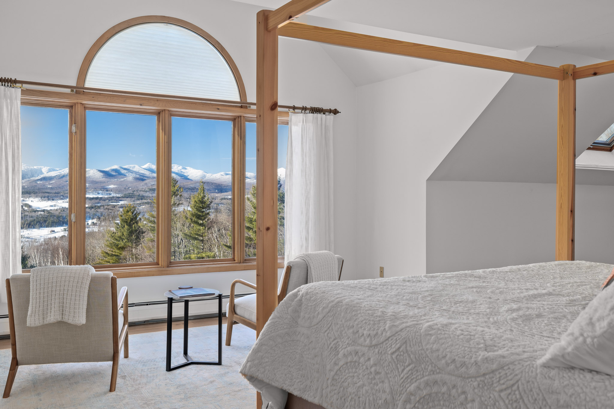 A cozy canopy bed makes way for a grand vaulted ceiling in the master bedroom. A cozy canopy bed makes way for a grand vaulted ceiling in the master bedroom. - Modern Retreat ~ Stunning Mountain View ~ Hot Tub! - Stowe