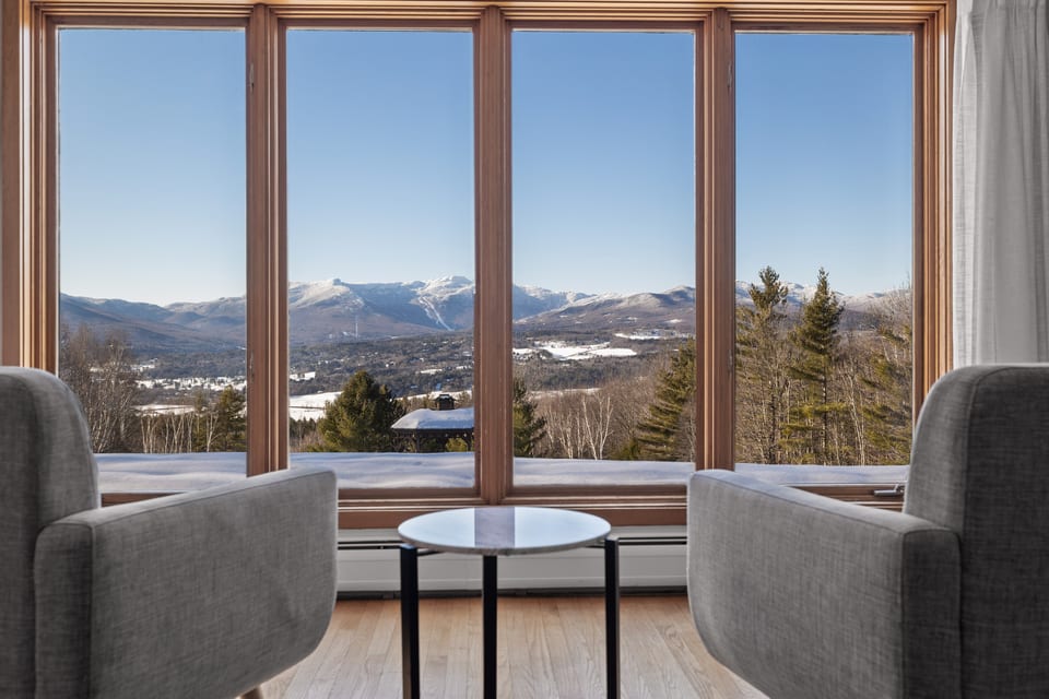 Enjoy the amazing view of Mt. Mansfield from the cozy chairs in the living room.
