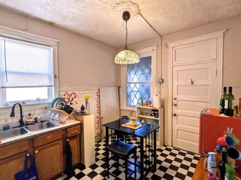 Quick view of upstairs "half kitchen," middle of tile restoral.
NOTE there is a microwave and induction burner, NO STOVE.